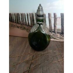 Mooie brocante fles met zilveren decoratie. Maat op de foto.