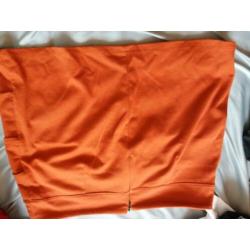 Oranje mini rokje maat M/L 40/42