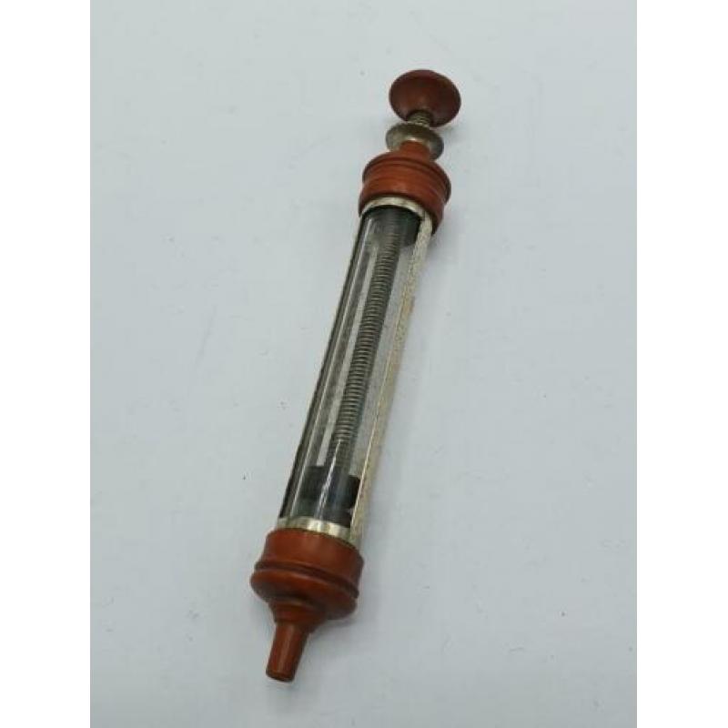 Antiek medische tongue depressor en spuit